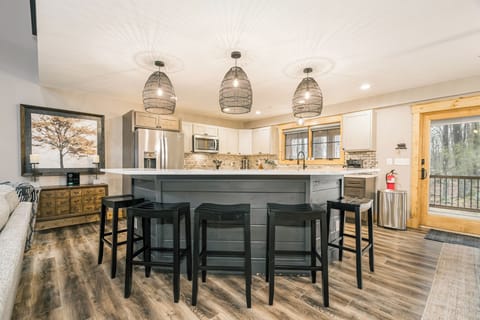 The roomy kitchen island has seating for 5.