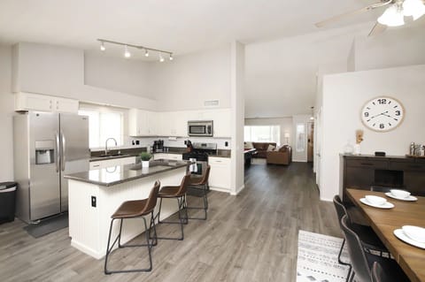 Bright open kitchen and dinning room with plenty of space for everyone.