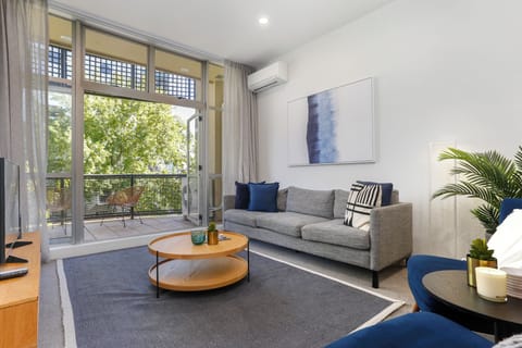 Two Bedroom Apartment with Parking | Living area | 55-inch Smart TV with digital channels