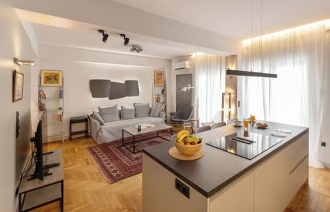 Design Apartment, 2 Bedrooms | Living area | 55-inch Smart TV with digital channels
