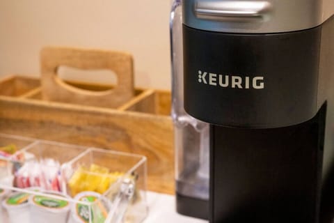 A Keurig is provided at the coffee bar located just off the kitchen.