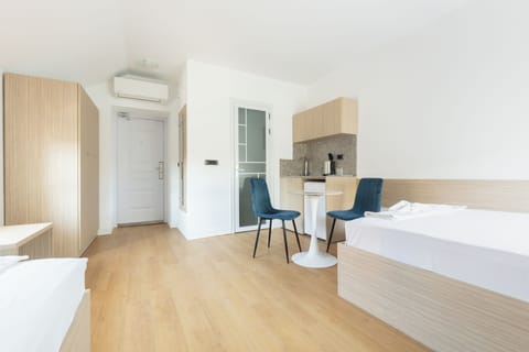 Basic Room, 1 Bedroom, Non Smoking, City View | Desk, laptop workspace, free WiFi, bed sheets