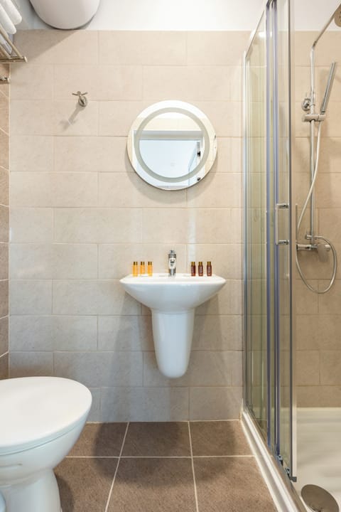 Family Room, 1 Bedroom, Non Smoking, City View | Bathroom | Shower, free toiletries, towels, soap