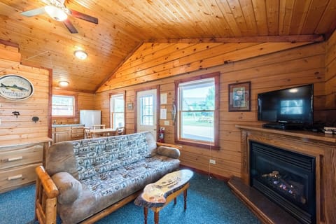Cedar Cabin Living Space

Enjoy the amenities of home in the quaint 2 bedroom log cabin.  This is a view into the kitchen, big enough to cook & enjoy meals or small enough if you would rather leave the mess to someone else and eat out!    The log cabins on the Ranch all have gas fire places.  They are nice to enjoy watching the fire, but they are also an alternative heat source for the cabin!  