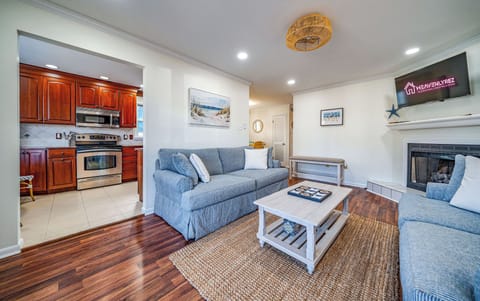 Cozy living room with fireplace and mounted TV
