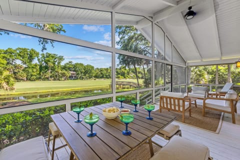Immerse yourself in the outdoors from the comfort of a screened-in porch, complete with tranquil lagoon and golf course views.