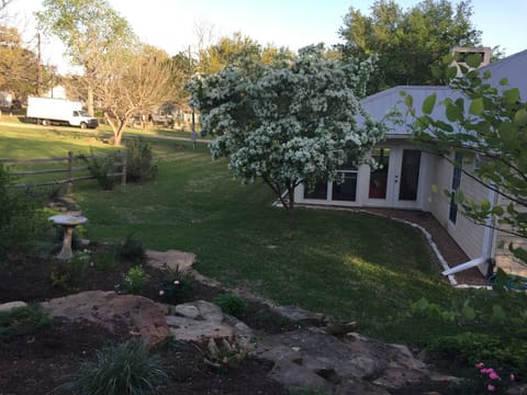 This house has plenty of yard to roam and a custom-built rock garden.