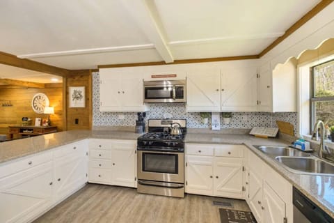 Fully stocked kitchen has ample cookware, tableware and glassware for quick food on the run or full meals.