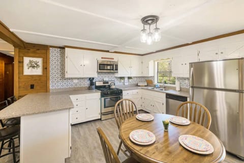 Ample seating at dining table and kitchen bar area