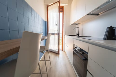 Apartment, Sea View | Private kitchen | Espresso maker, electric kettle, toaster, highchair