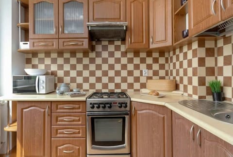 The kitchen offers a functional layout for convenient cooking. 