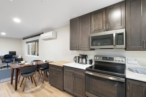 Enjoy a roomy kitchen that blends effortlessly with a warm, cozy dining area, ideal for shared meals and moments.