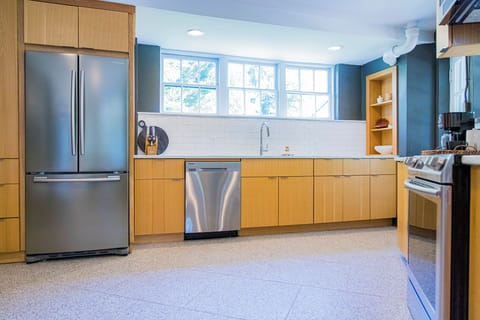 Large windows and new stainless steal appliances make this a dream kitchen