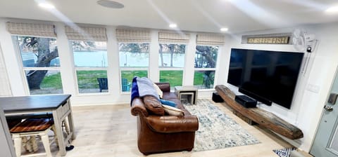 River View Room.  Large windows provide views of yard & river. 85" TV 5.1 sound.