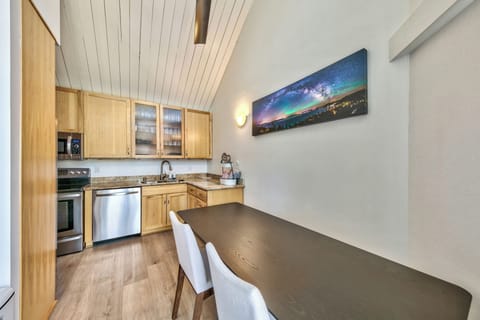 Dining table with seating and dishware for a family of 4