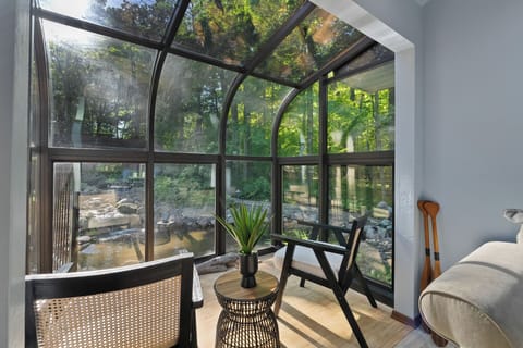 Sitting area overlooks the pond and surrounding garden