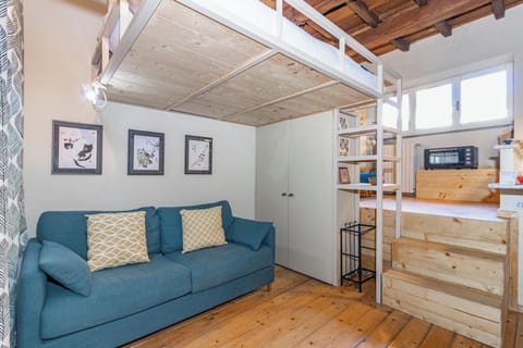 City Studio | Living area | 30-inch flat-screen TV with digital channels