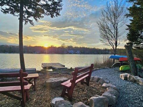 Lakeside firepit with sunset views—perfect for relaxing by the water.