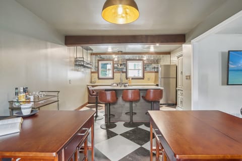 Booth seating with room for 6, as well as 4 bar stools at the island!