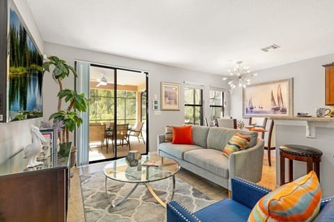 Back open floor plan bonus 2nd living room, dining and kitchen areas all with lovely views of the private patio & pool.