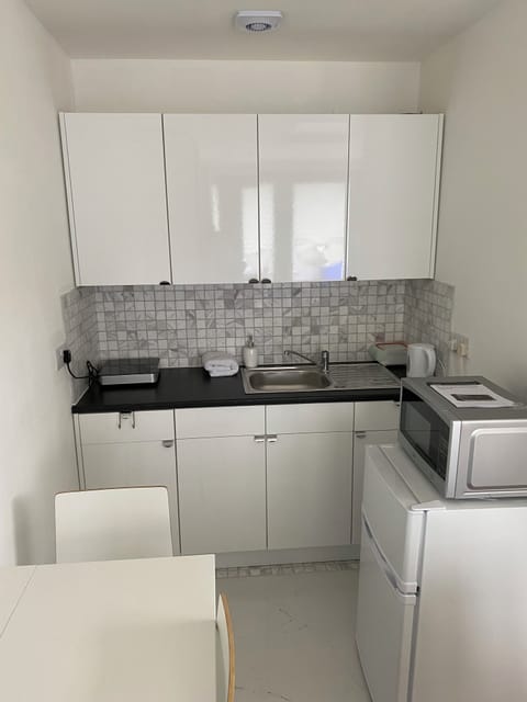 Kitchen area: includes fridge/freezer, microwave/grill, hob, kettle& toaster 