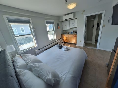 Rest easy in our cozy guest room, featuring a Queen-sized bed and dedicated bedside charging stations for all your devices.
