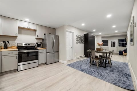 Charming kitchen and dining space, equipped with elegant cabinetry and a cozy dining nook.