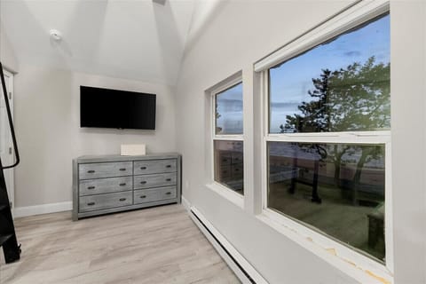 Bedroom window offering a serene view of the backyard