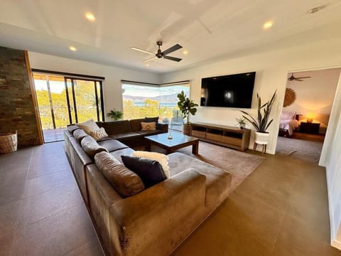 Spacious lounge room with smart TV overlooking Hobart