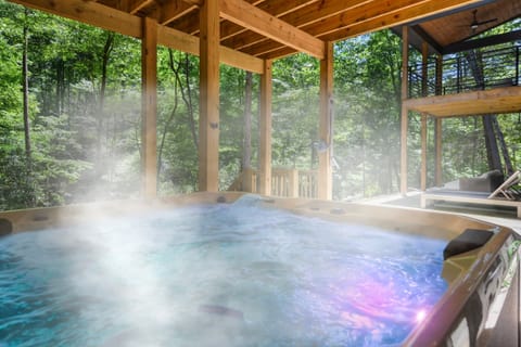 Spend evenings in the private hot tub on the patio while listening to the sounds of the creek