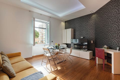 Apartment | Living area | 30-inch flat-screen TV with digital channels