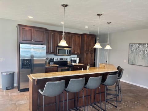 Six bar stools to facilitate friends and family time during meal prep