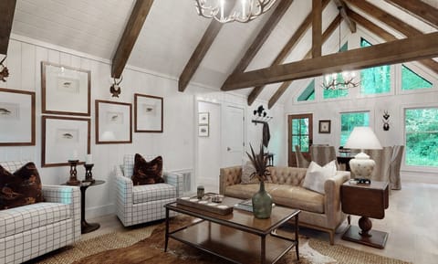 Rustic living room with vaulted ceilings and large windows overlooking greenery.
