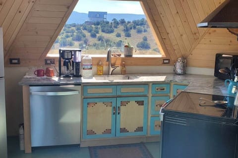 Our kitchen features a full sized fridge, range, dishwasher, microwave, coffee maker, tea kettle and a water dispenser with hot and cold water options.