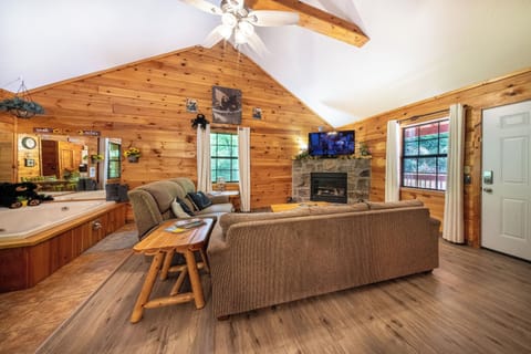 Living Room: Sun-kissed wood accents and a cozy fireplace create the perfect relaxation spot!