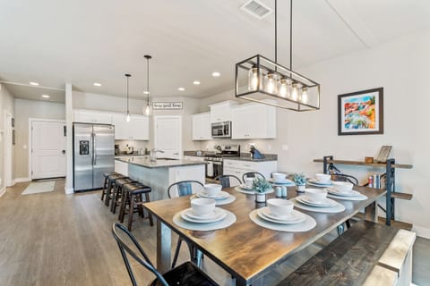 Open concept kitchen and dining space with table for 8 