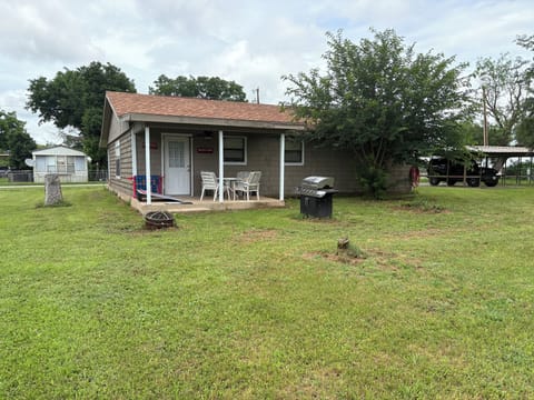 Back of house. 2 car carport to the side.