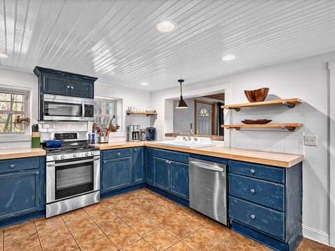 Spacious kitchen loaded with essentials. Laundry area is off the kitchen.