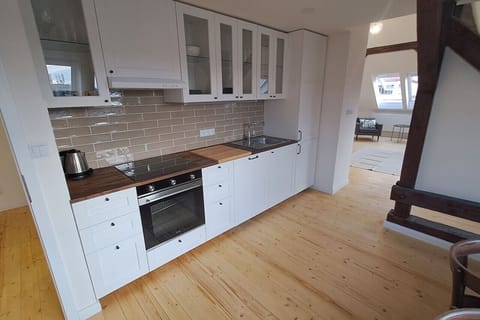 full kitchen with oven and essentials