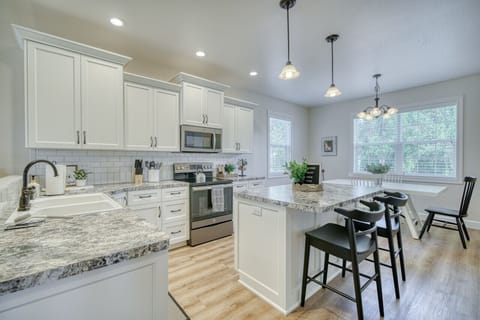 Spacious modern kitchen with a large island, perfect for cooking and entertaining.