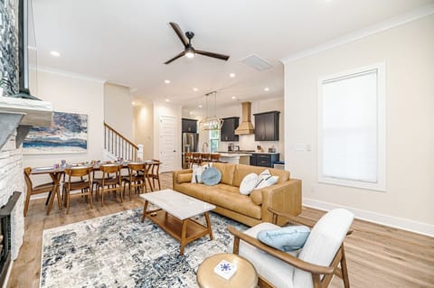 Main living room with kitchen in background