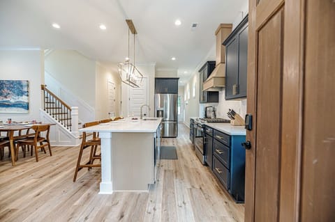 Upon entering you will be greeted with the kitchen and main living room