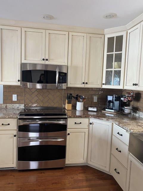 Kitchen has lots of space and supplies.