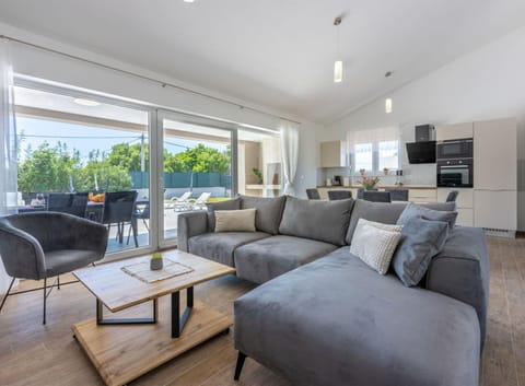 Villa (Three Bedroom Villa with Swiming Pool) | Living room | 32-inch flat-screen TV with satellite channels