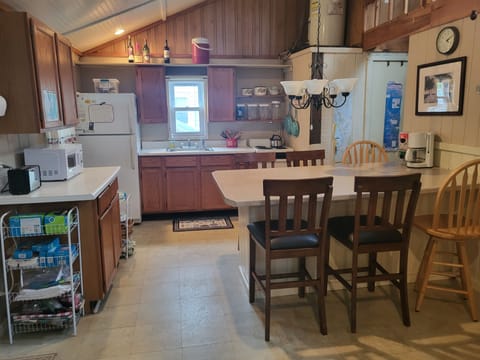 Convenience: microwave, coffeemaker, electric stove. large eating area counter