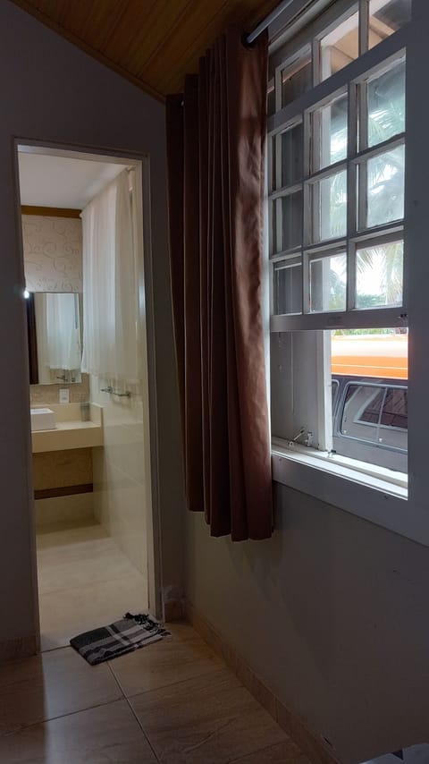 Superior Triple Room, Partial Ocean View | Blackout drapes, iron/ironing board, free WiFi
