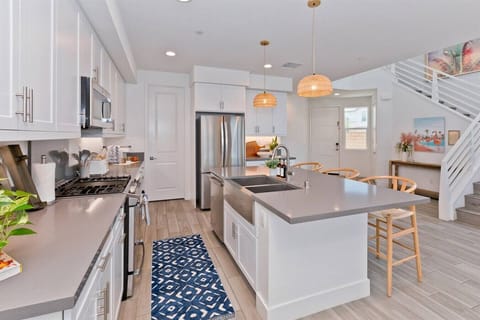 Modern design with sleek appliances and vibrant lighting for culinary masterpieces!