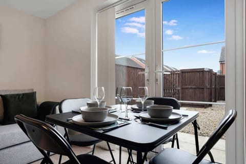 A comfortable 4-seater dining table, perfect for cozy gatherings, shared meals, and creating memorable moments with family or friends during your stay.