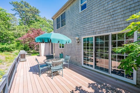 Large private deck overlooking mature trees and native flowers