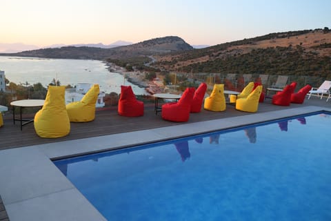 Outdoor pool, open 10:00 AM to 8:00 PM, pool umbrellas